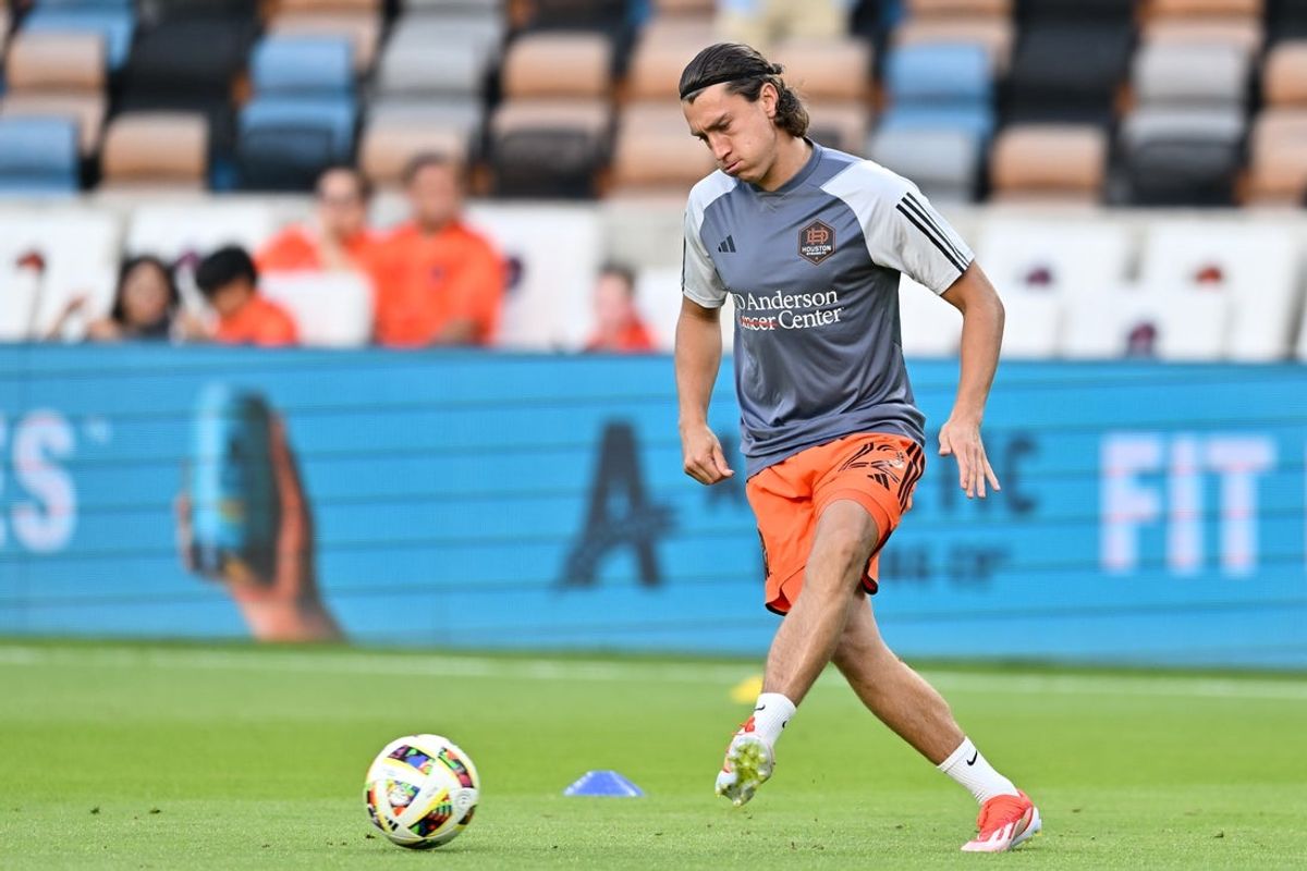 May 18, 2024; Houston, Texas, USA; Houston Dynamo FC defender Tate Schmitt (22) warms up prior to the match against FC Dallas at Shell Energy Stadium. Mandatory Credit: Maria Lysaker-Imagn Images