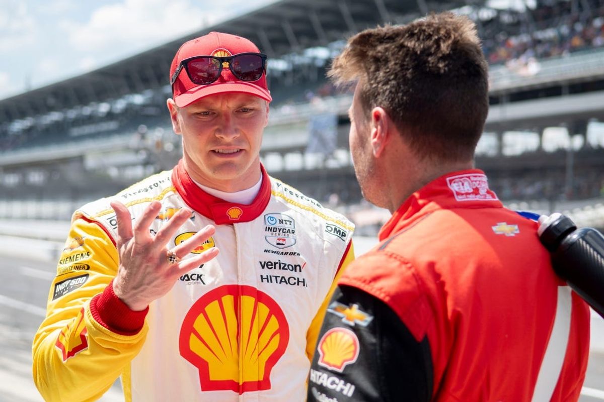 Team Penske driver Josef Newgarden (2) talks with Team Penske driver Will Power (12) on Sunday, May 19, 2024, during practice ahead of qualifying for the 108th running of the Indianapolis 500 at Indianapolis Motor Speedway.