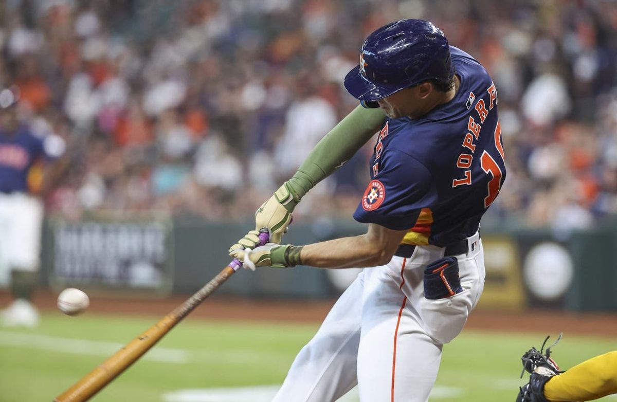 May 19, 2024; Houston, Texas, USA; Houston Astros left fielder Joey Loperfido (10) hits a single during the second inning against the Milwaukee Brewers at Minute Maid Park. Mandatory Credit: Troy Taormina-USA TODAY Sports