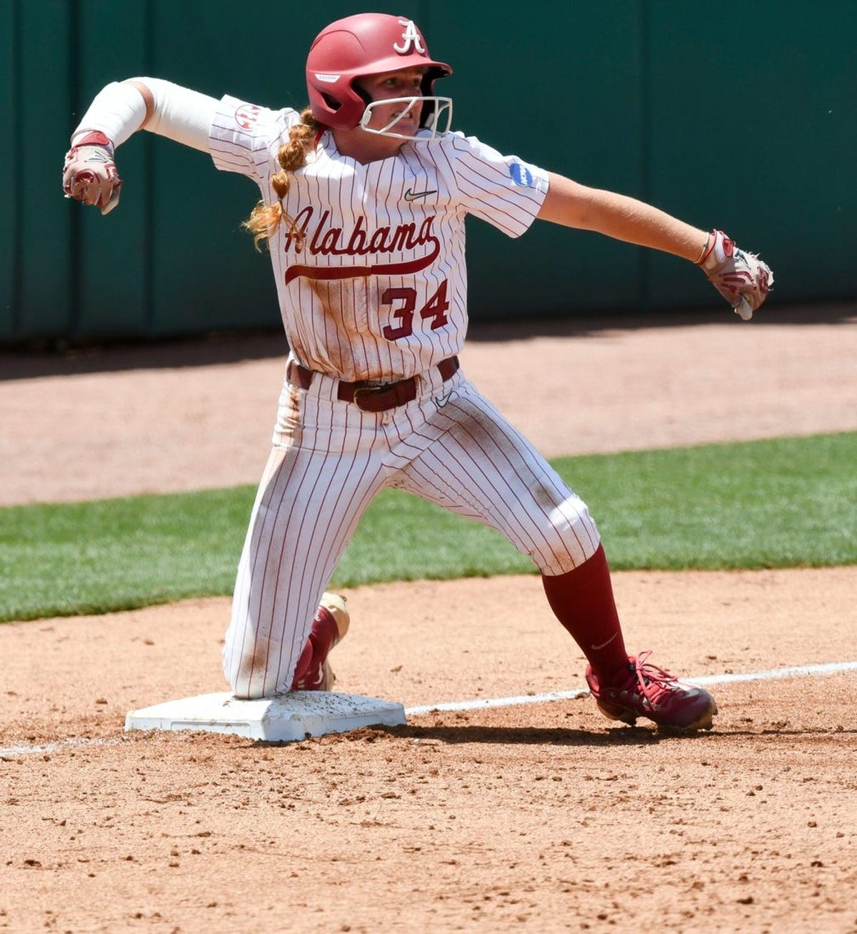 May 19 2024; Tuscaloosa, AL, USA; Alabama batter Marlie Giles (34) expresses her joy after reaching third on a double by a teammate at Rhoads Stadium Sunday. Alabama defeated Southeastern Louisiana 12-2 in 5 innings to advance to the Super Regional.