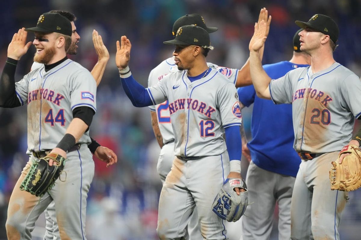 May 19, 2024; Miami, Florida, USA;  New York Mets shortstop Francisco Lindor (12) and teammates celebrate a victory over the Miami Marlins at loanDepot Park. Mandatory Credit: Jim Rassol-USA TODAY Sports