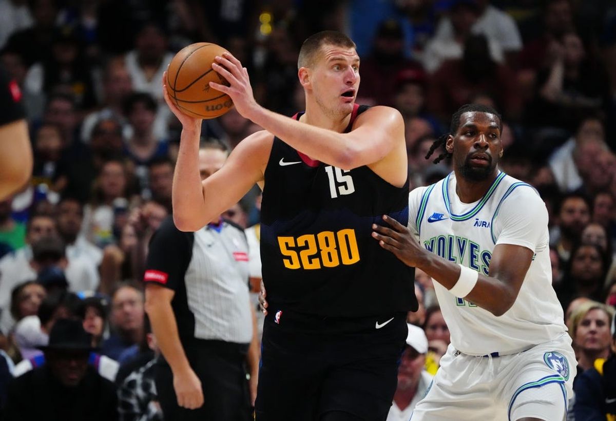 May 19, 2024; Denver, Colorado, USA; Minnesota Timberwolves center Naz Reid (11) defends Denver Nuggets center Nikola Jokic (15) in the first half in game seven of the second round for the 2024 NBA playoffs at Ball Arena. Mandatory Credit: Ron Chenoy-USA TODAY Sports