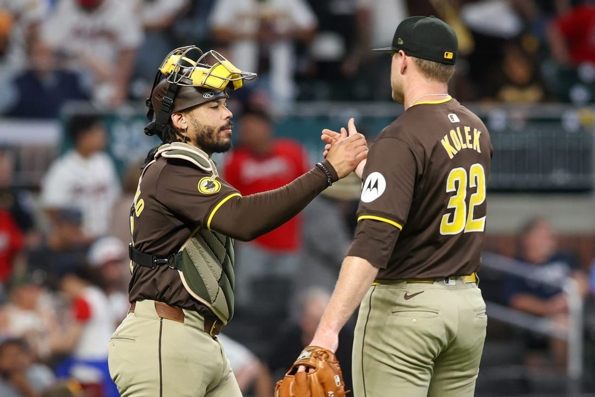 May 19, 2024; Atlanta, Georgia, USA; San Diego Padres catcher Luis Campusano (12) and relief pitcher Stephen Kolek (32) celebrate after a victory against the Atlanta Braves at Truist Park. Mandatory Credit: Brett Davis-USA TODAY Sports