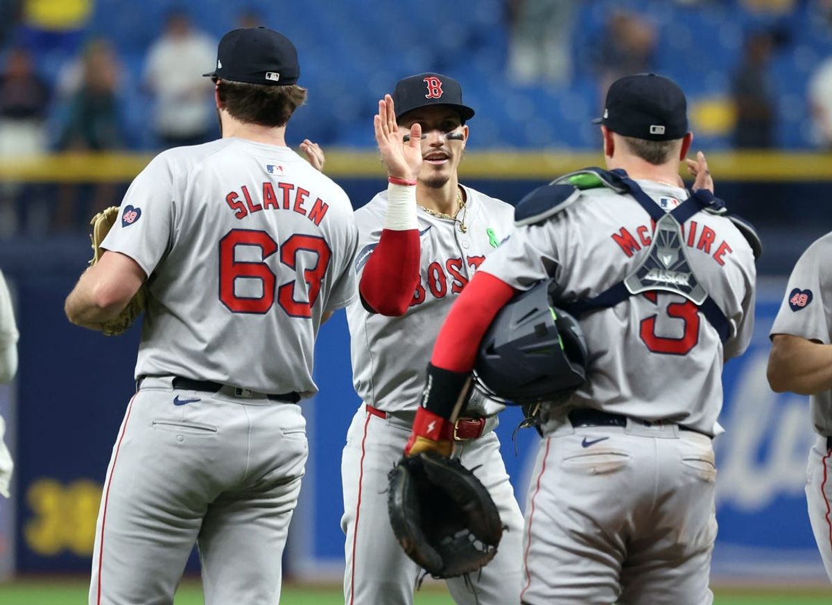 May 20, 2024; St. Petersburg, Florida, USA;  Boston Red Sox outfielder Jarren Duran (16) , pitcher Justin Slaten (63), catcher Reese McGuire (3) high five after they beat the Tampa Bay Rays at Tropicana Field. Mandatory Credit: Kim Klement Neitzel-USA TODAY Sports