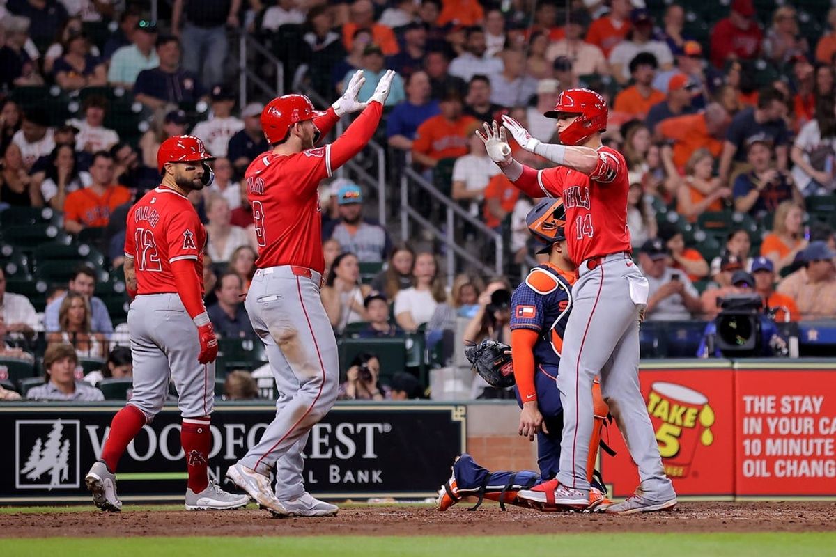 May 20, 2024; Houston, Texas, USA; Los Angeles Angels catcher Logan O'Hoppe (14) is congratulated by Los Angeles Angels left fielder Taylor Ward (3) after hitting a three-run home run against the Houston Astros during the fifth inning at Minute Maid Park. Mandatory Credit: Erik Williams-USA TODAY Sports