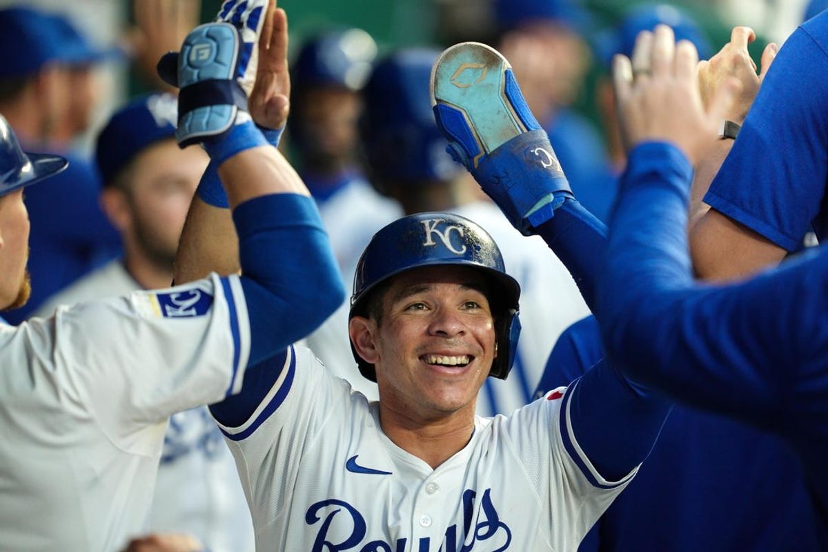 May 20, 2024; Kansas City, Missouri, USA; Kansas City Royals catcher Freddy Fermin (34) is congratulated by teammates after scoring a run during the sixth inning against the Detroit Tigers at Kauffman Stadium. Mandatory Credit: Jay Biggerstaff-USA TODAY Sports