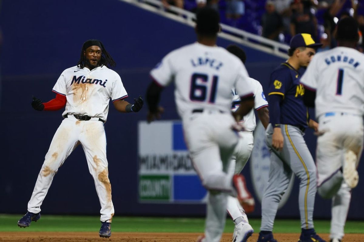 May 20, 2024; Miami, Florida, USA; Miami Marlins first baseman Josh Bell (9) celebrates with teammates after winning the game against the Milwaukee Brewers during the tenth inning at loanDepot Park. Mandatory Credit: Sam Navarro-USA TODAY Sports