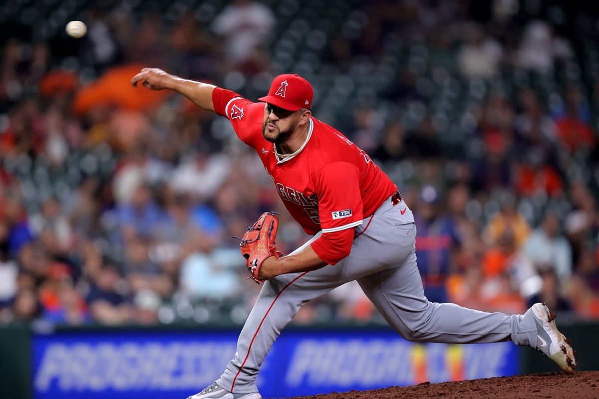 May 20, 2024; Houston, Texas, USA; Los Angeles Angels relief pitcher Carlos Estevez (53) delivers a pitch against the Houston Astros during the ninth inning at Minute Maid Park. Mandatory Credit: Erik Williams-USA TODAY Sports