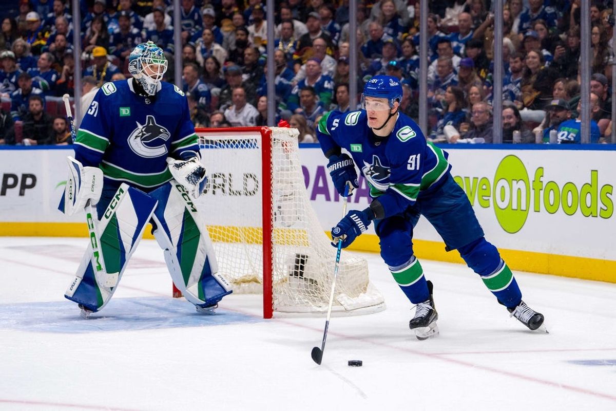 May 16, 2024; Vancouver, British Columbia, CAN; Vancouver Canucks goalie Arturs Silvos (31) watches as defenseman Nikita Zadorov (91) handles the puck against the Edmonton Oilers during the second period in game five of the second round of the 2024 Stanley Cup Playoffs at Rogers Arena. Mandatory Credit: Bob Frid-USA TODAY Sports