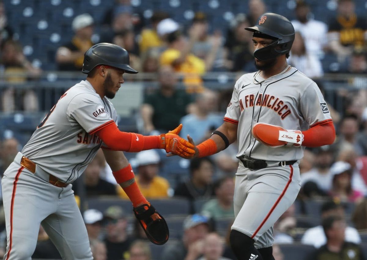 May 21, 2024; Pittsburgh, Pennsylvania, USA;  San Francisco Giants second baseman Thairo Estrada (left) and center fielder Luis Matos (right) celebrate after both players scored runs against the Pittsburgh Pirates during the first inning at PNC Park. Mandatory Credit: Charles LeClaire-USA TODAY Sports