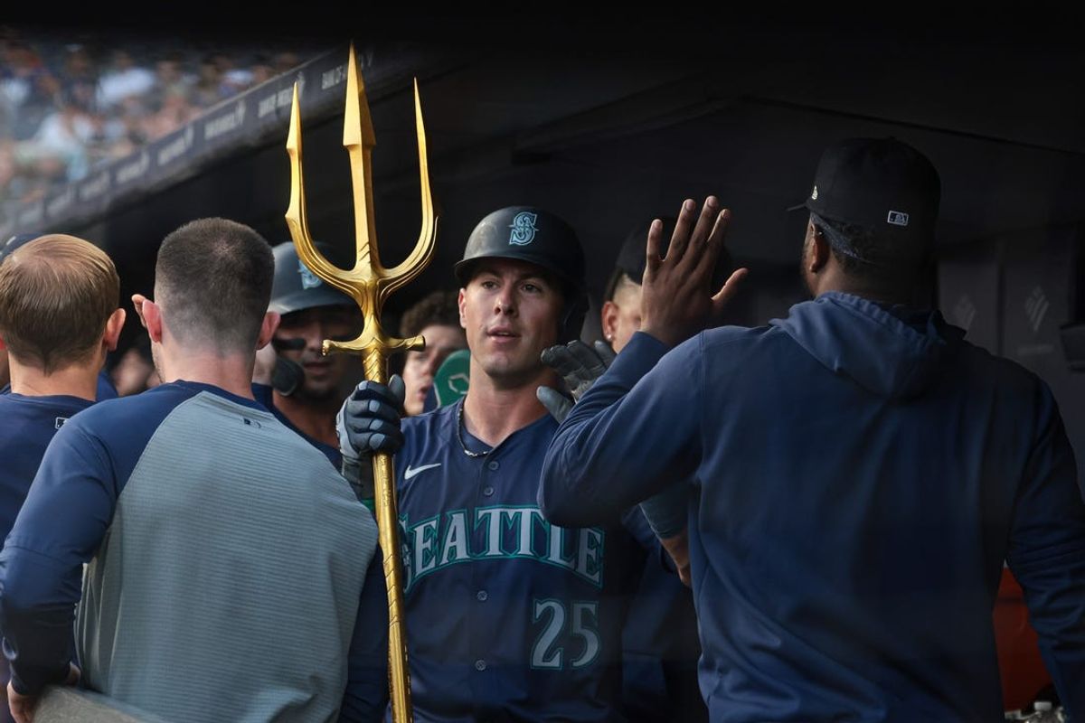 May 21, 2024; Bronx, New York, USA; Seattle Mariners shortstop Dylan Moore (25) celebrates teammates after hitting a two run home run during the third inning against the New York Yankees at Yankee Stadium. Mandatory Credit: Vincent Carchietta-USA TODAY Sports