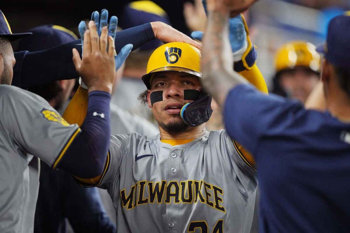 May 21, 2024; Miami, Florida, USA;  Milwaukee Brewers catcher William Contreras (24) celebrates scoring a run in the eighth inning against the Miami Marlins at loanDepot Park. Mandatory Credit: Jim Rassol-USA TODAY Sports