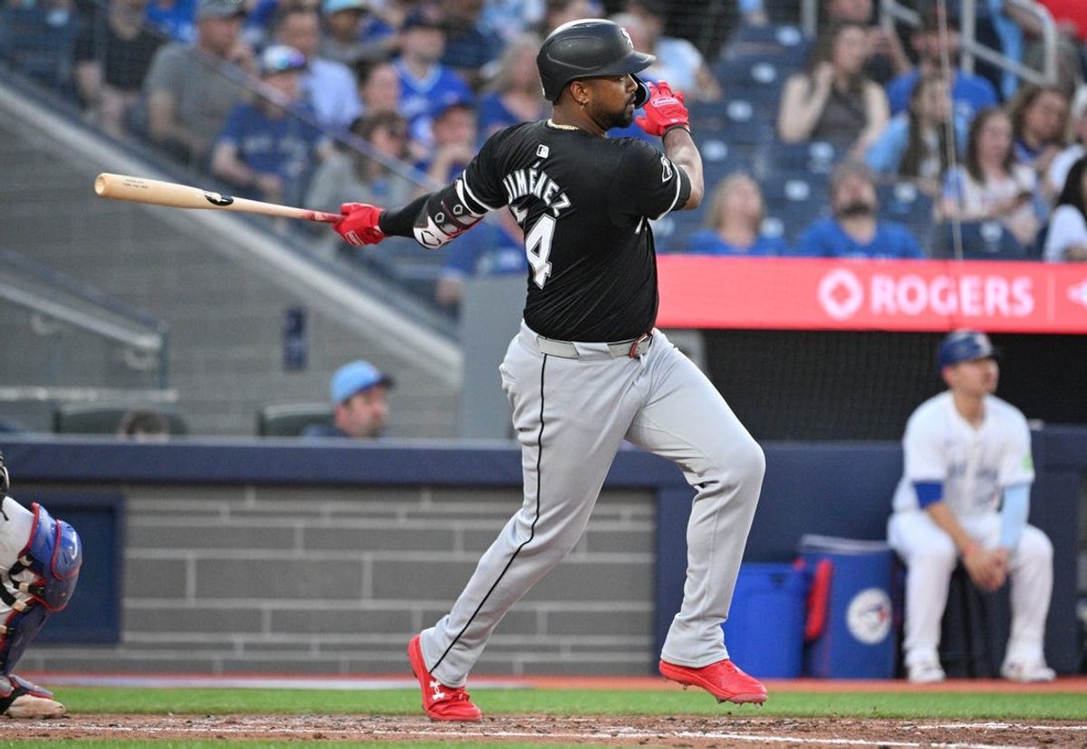 May 21, 2024; Toronto, Ontario, CAN;  Chicago White Sox designated hitter Eloy Jimenez (74) hits a double against the Toronto Blue Jays in the sixth inning at Rogers Centre. Mandatory Credit: Dan Hamilton-USA TODAY Sports