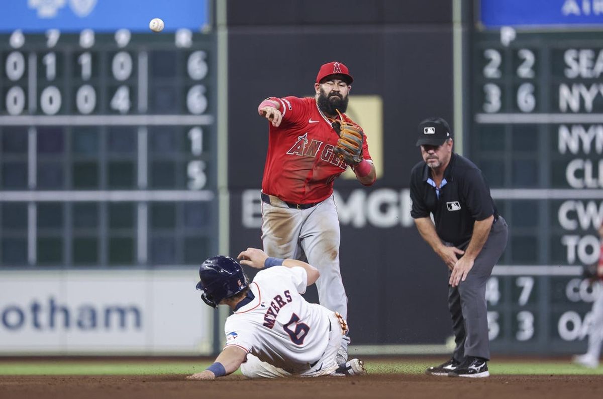 May 21, 2024; Houston, Texas, USA; Houston Astros center fielder Jake Meyers (6) is out at second baseman as Los Angeles Angels second baseman Luis Guillorme (15) throws to first base during the sixth inning at Minute Maid Park. Mandatory Credit: Troy Taormina-USA TODAY Sports