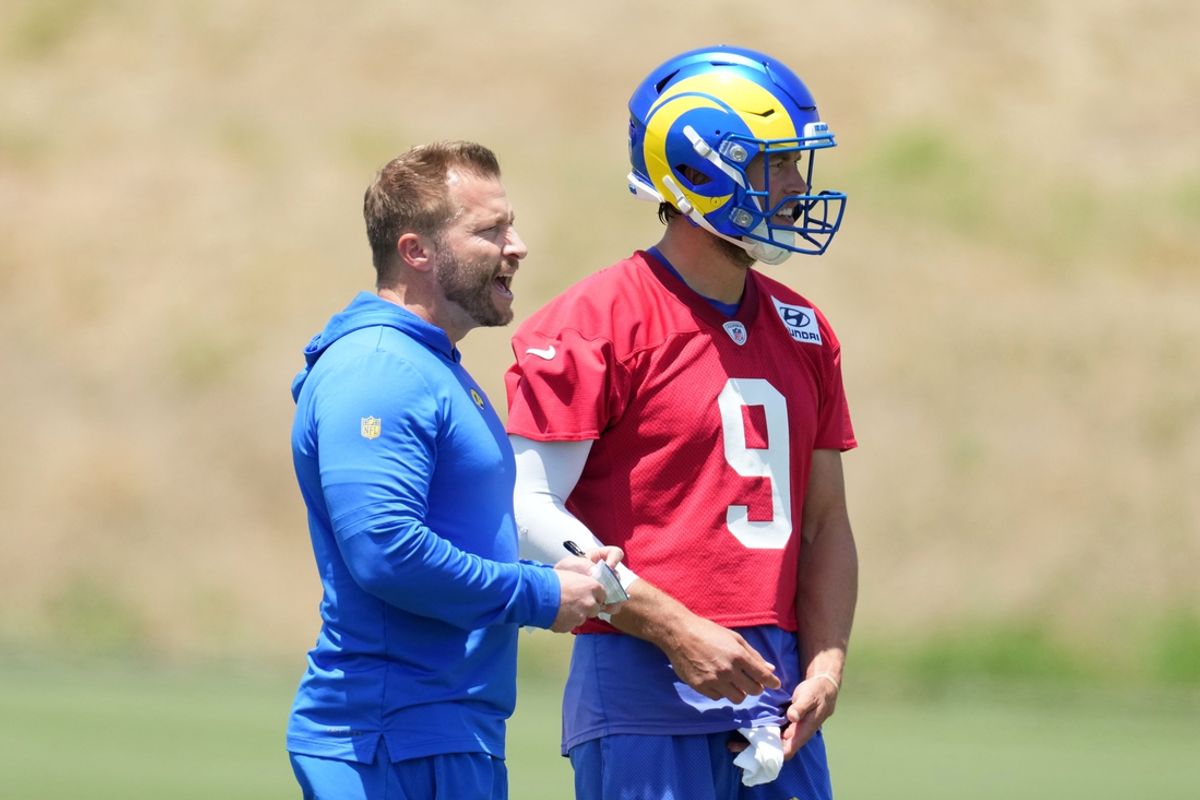 May 21, 2024, Thousand Oaks, California, USA; Los Angeles Rams coach Sean McVay (left) talks with quarterback Matthew Stafford (9) during organized team activities at Cal Lutheran University. Mandatory Credit: Kirby Lee-Imagn Images