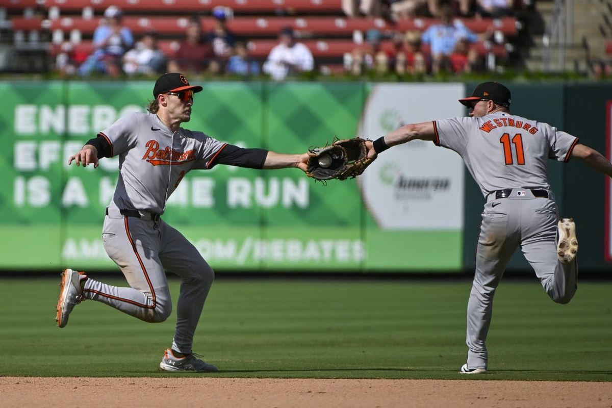 May 22, 2024; St. Louis, Missouri, USA;  Baltimore Orioles shortstop Gunnar Henderson (2) fields a ground ball in front of second baseman Jordan Westburg (11) against the St. Louis Cardinals during the seventh inning at Busch Stadium. Mandatory Credit: Jeff Curry-USA TODAY Sports