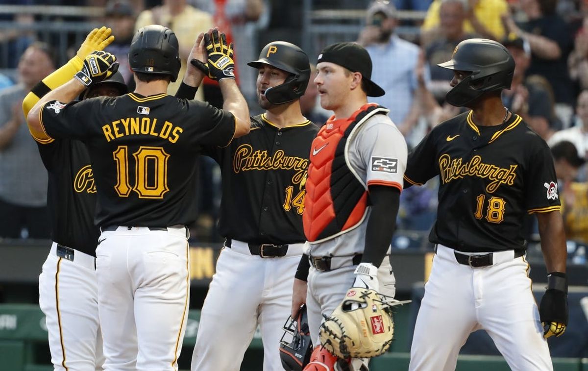May 22, 2024; Pittsburgh, Pennsylvania, USA;  Pittsburgh Pirates left fielder Bryan Reynolds (10) celebrates his grand slam home run with designated hitter Andrew McCutchen (hidden), catcher Joey Bart (14) and outfielder Michael A. Taylor (18) against the San Francisco Giants during the fourth inning at PNC Park. Mandatory Credit: Charles LeClaire-USA TODAY Sports