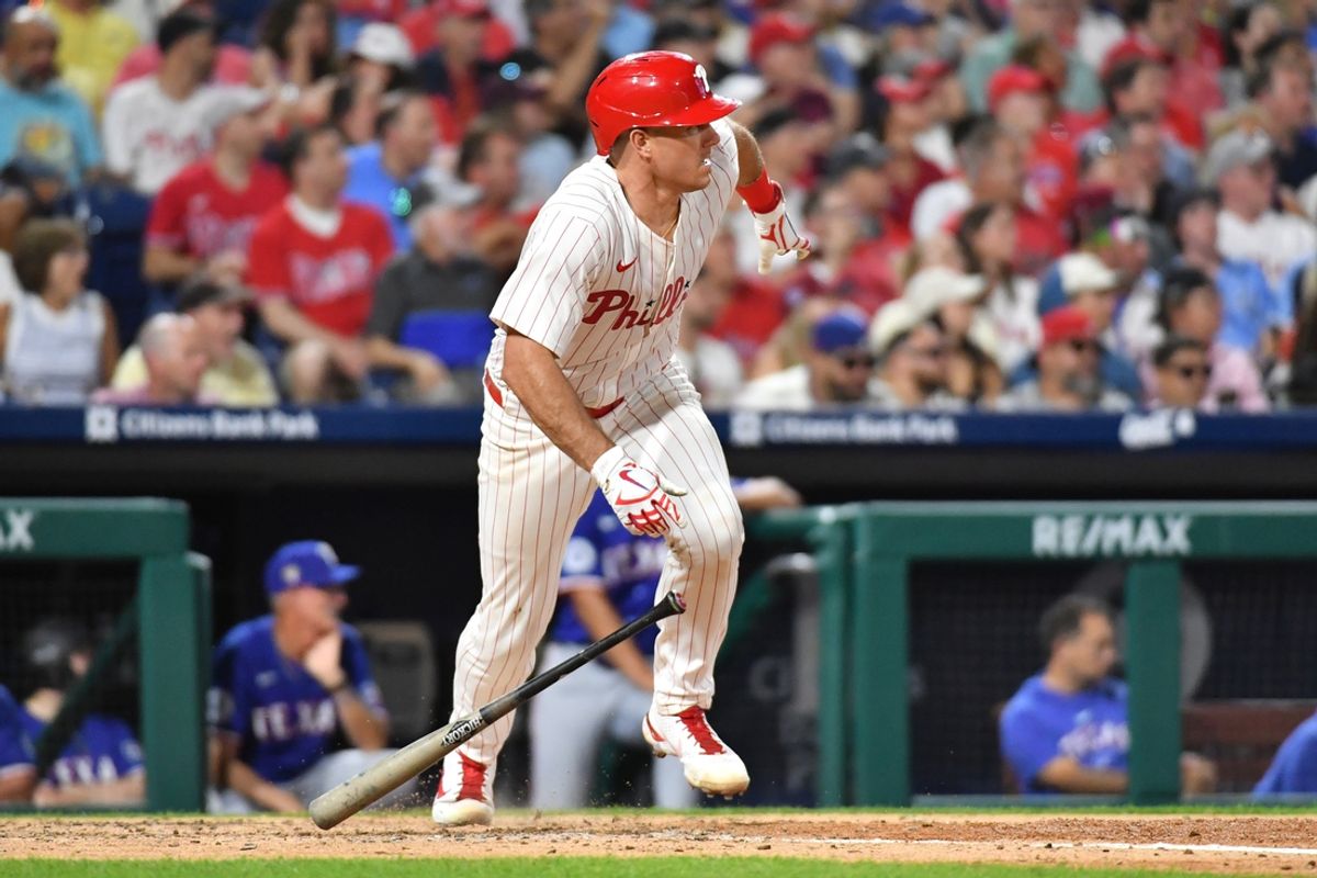 May 22, 2024; Philadelphia, Pennsylvania, USA; Philadelphia Phillies catcher J.T. Realmuto (10) hits a two RBI single against the Texas Rangers during the sixth inning at Citizens Bank Park. Mandatory Credit: Eric Hartline-USA TODAY Sports