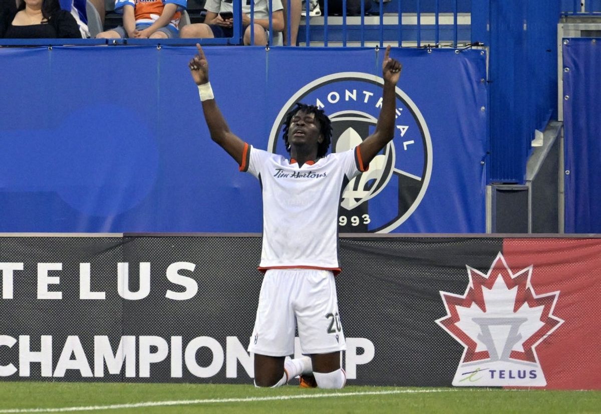 May 22, 2024; Montreal, Quebec, CAN; Forge FC Hamilton midfielder Kwasi Poku (20) celebrates after scoring a goal against the CF Montreal during the first half at Stade Saputo. Mandatory Credit: Eric Bolte-Imagn Images