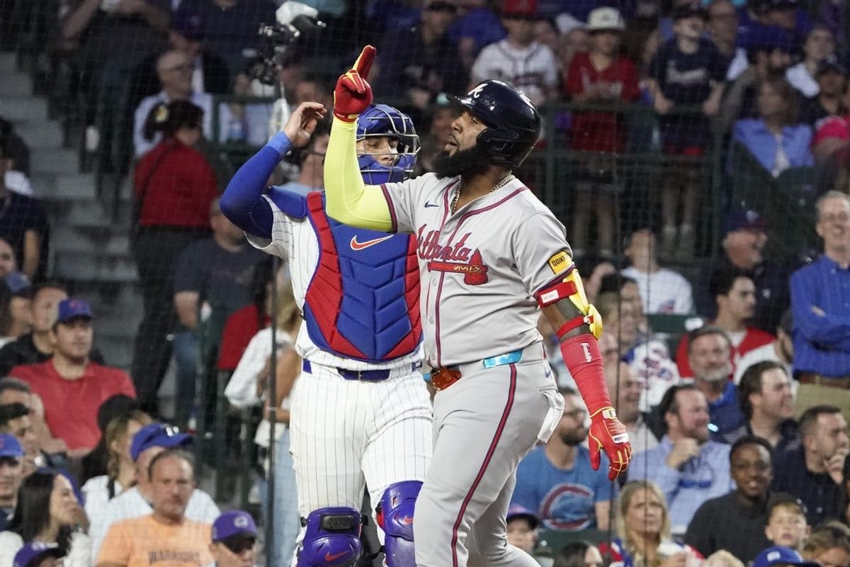 May 22, 2024; Chicago, Illinois, USA; Atlanta Braves designated hitter Marcell Ozuna (20) celebrates after hitting a grand slam home run against the Chicago Cubs during the seventh inning at Wrigley Field. Mandatory Credit: David Banks-USA TODAY Sports