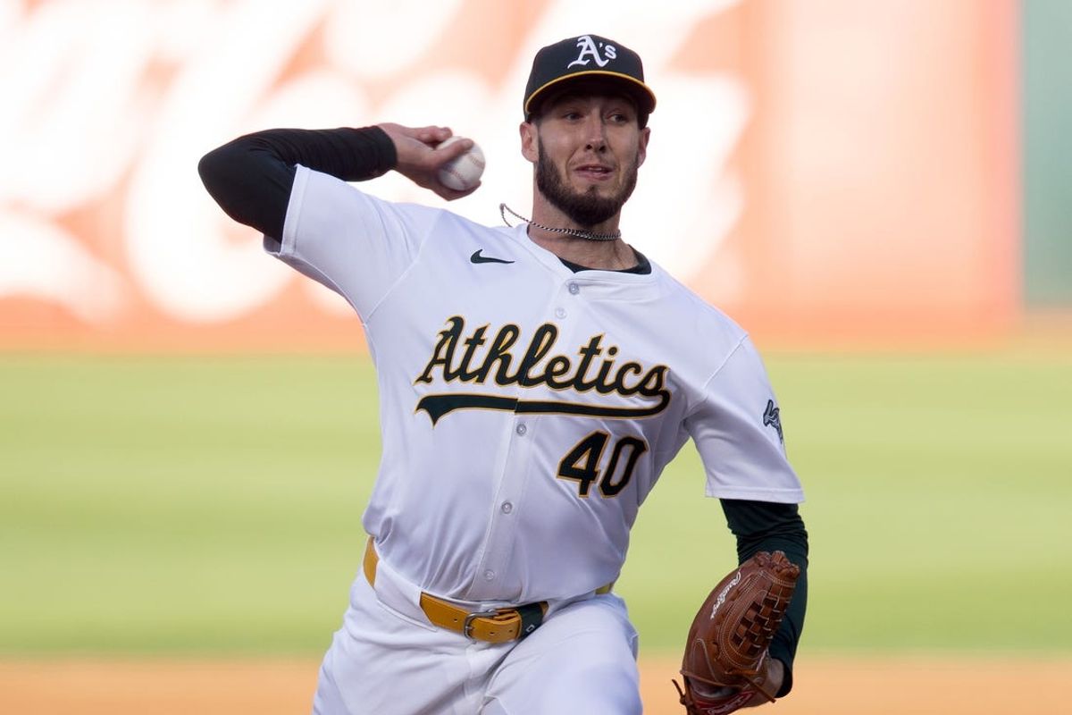May 22, 2024; Oakland, California, USA; Oakland Athletics pitcher Mitch Spence (40) delivers a pitch against the Colorado Rockies during the first inning at Oakland-Alameda County Coliseum. Mandatory Credit: D. Ross Cameron-USA TODAY Sports