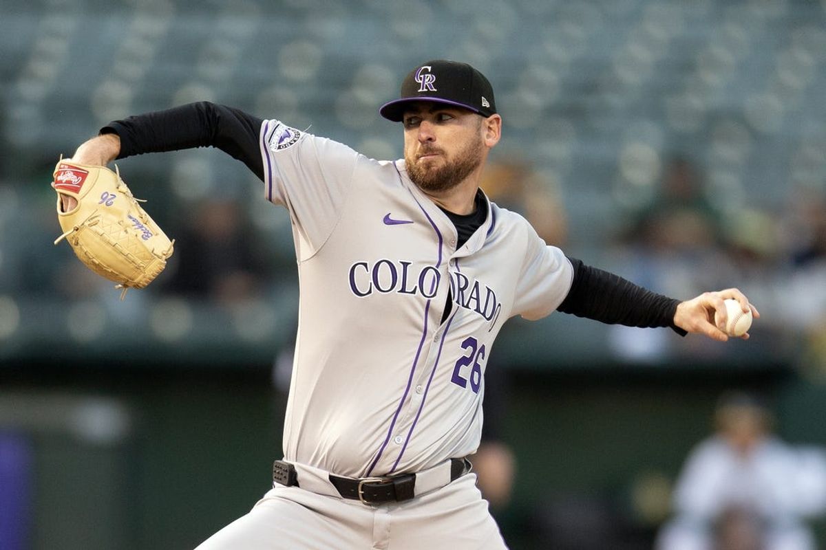 May 22, 2024; Oakland, California, USA; Colorado Rockies starting pitcher Austin Gomber (26) delivers a pitch against the Oakland Athletics during the fourth inning at Oakland-Alameda County Coliseum. Mandatory Credit: D. Ross Cameron-USA TODAY Sports