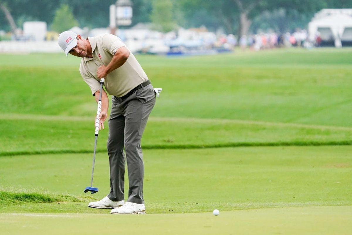 May 23, 2024; Fort Worth, Texas, USA; Adam Scott putts on the tenth green during the first round of the Charles Schwab Challenge golf tournament. Mandatory Credit: Raymond Carlin III-USA TODAY Sports