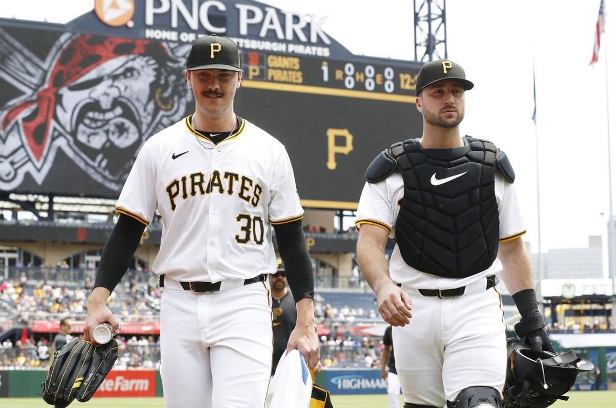 May 23, 2024; Pittsburgh, Pennsylvania, USA; Pittsburgh Pirates starting pitcher Paul Skenes (30) and catcher Joey Bart (14) make their way in from the dugout to play the San Francisco Giants at PNC Park. Mandatory Credit: Charles LeClaire-USA TODAY Sports