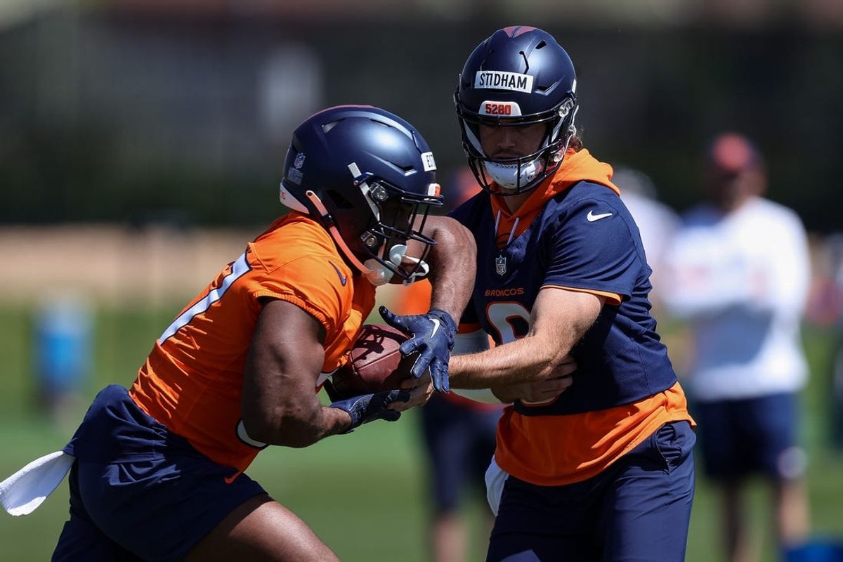 May 23, 2024; Englewood, CO, USA; Denver Broncos quarterback Jarrett Stidham (8) and running back Audric Estime (37) during organized team activities at Centura Health Training Center. Mandatory Credit: Isaiah J. Downing-USA TODAY Sports