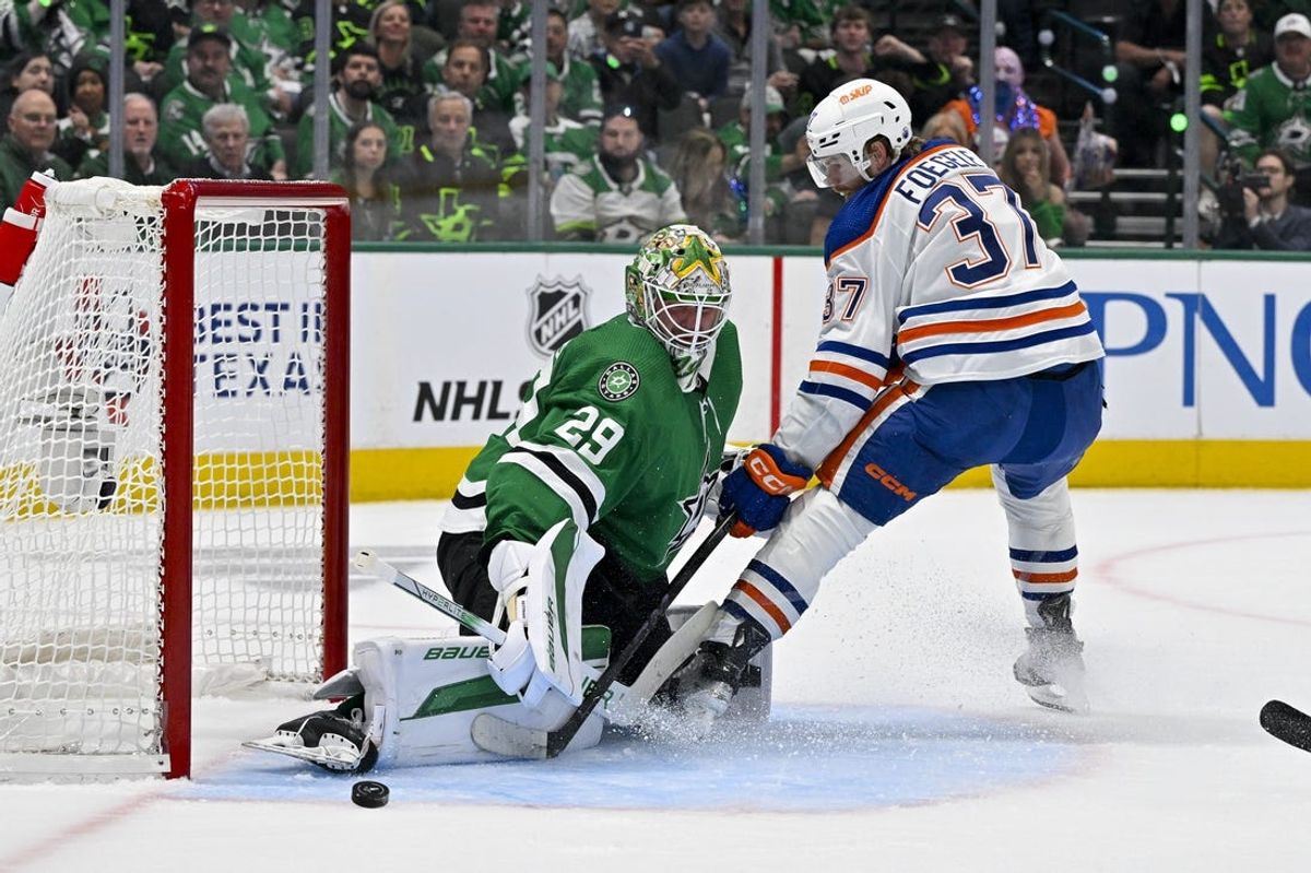 May 23, 2024; Dallas, Texas, USA; Dallas Stars goaltender Jake Oettinger (29) turns aside a shot by Edmonton Oilers left wing Warren Foegele (37) during the first period in game one of the Western Conference Final of the 2024 Stanley Cup Playoffs at American Airlines Center. Mandatory Credit: Jerome Miron-USA TODAY Sports