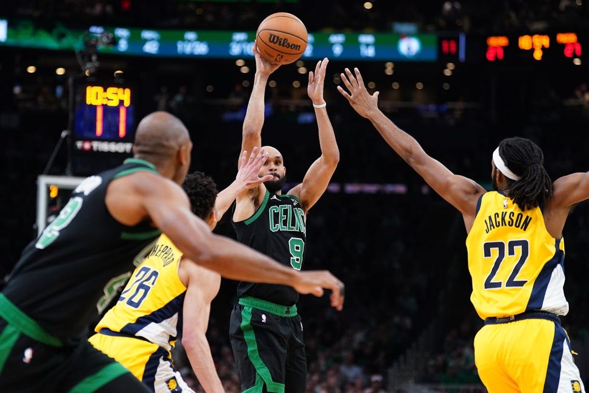 May 23, 2024; Boston, Massachusetts, USA; Boston Celtics guard Derrick White (9) shoots the ball over Indiana Pacers forward Isaiah Jackson (22) in the first half during game two of the eastern conference finals for the 2024 NBA playoffs at TD Garden. Mandatory Credit: David Butler II-USA TODAY Sports