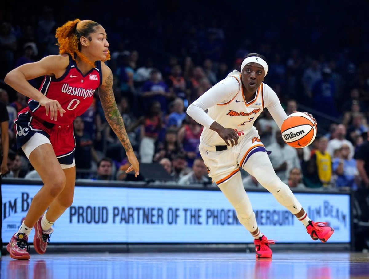 Mercury guard Kahleah Copper (2) drives against Mystics center Shakira Austin (0) during a game at the Footprint Center in Phoenix on Thursday, May 23, 2024.