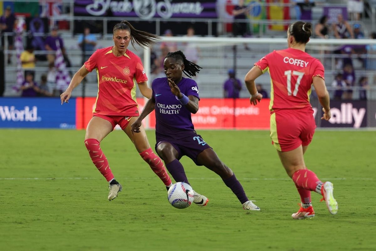 May 24, 2024; Orlando, Florida, USA; Orlando Pride forward Barbra Banda (22) cuts around Portland Thorns FC midfielder Sam Coffey (17) during the first half at Inter&Co Stadium. Mandatory Credit: Mike Watters-USA TODAY Sports