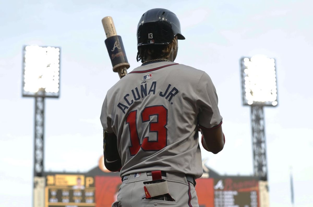 May 24, 2024; Pittsburgh, Pennsylvania, USA;  Atlanta Braves right fielder Ronald Acuna Jr. (13) in the on-deck circle against the Pittsburgh Pirates during the fifth inning  at PNC Park. Mandatory Credit: Charles LeClaire-Imagn Images