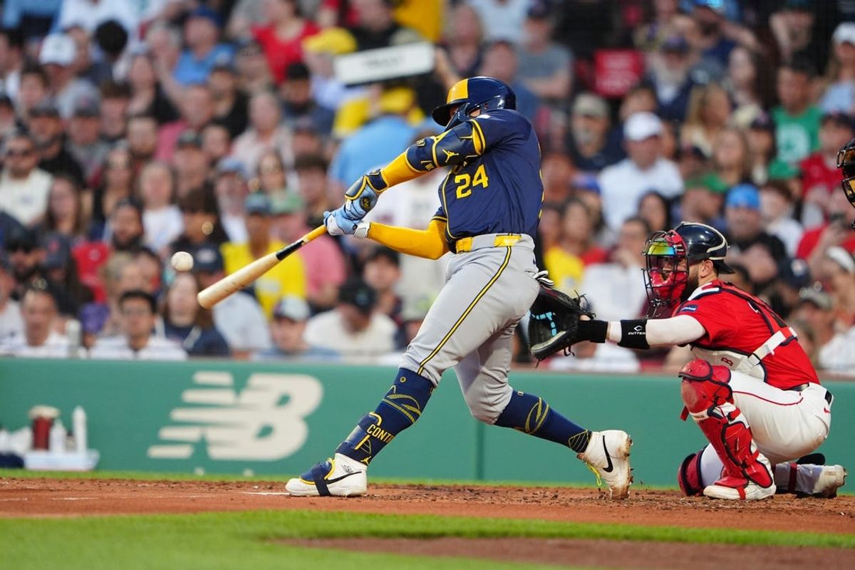 May 24, 2024; Boston, Massachusetts, USA; Milwaukee Brewers catcher William Contreras (24) hits a two-run home run against the Boston Red Sox during the third inning at Fenway Park. Mandatory Credit: Gregory Fisher-USA TODAY Sports