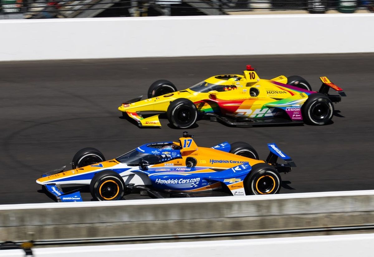 May 24, 2024; Indianapolis, Indiana, USA; IndyCar Series driver Kyle Larson (near) alongside Alex Palou during Carb Day final practice for the Indianapolis 500 at Indianapolis Motor Speedway. Mandatory Credit: Mark J. Rebilas-USA TODAY Sports