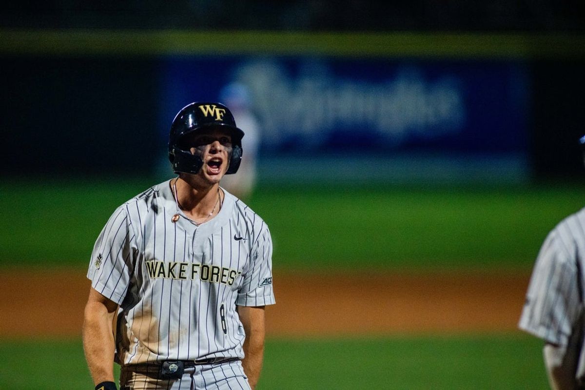 May 24, 2024; Charlotte, NC, USA; Wake Forest outfielder Nick Kurtz (8) celebrates a two run homer in the twelfth inning against the North Carolina Tar Heels during the ACC Baseball Tournament at Truist Field. Mandatory Credit: Scott Kinser-Imagn Images