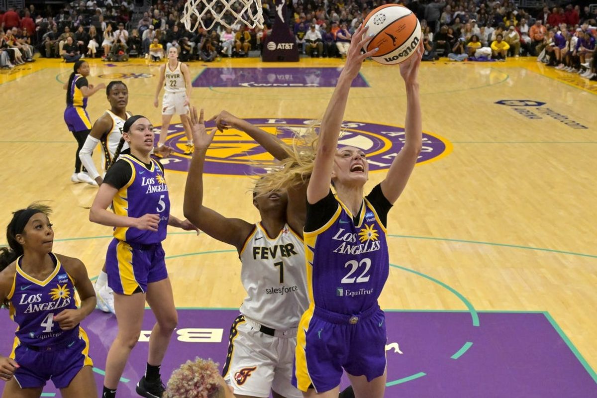 May 24, 2024; Los Angeles, California, USA;  Los Angeles Sparks forward Cameron Brink (22) beats Indiana Fever forward NaLyssa Smith (1) to a rebound in the second half at Crypto.com Arena. Mandatory Credit: Jayne Kamin-Oncea-USA TODAY Sports