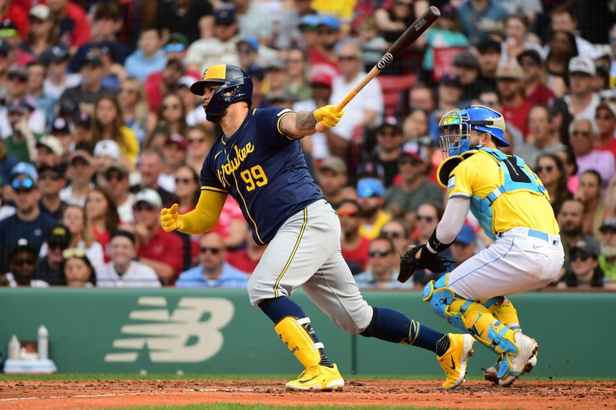 May 25, 2024; Boston, Massachusetts, USA;  Milwaukee Brewers designated hitter Gary Sánchez (99) hits a bloop RBI single during the third inning against the Boston Red Sox at Fenway Park. Mandatory Credit: Bob DeChiara-USA TODAY Sports