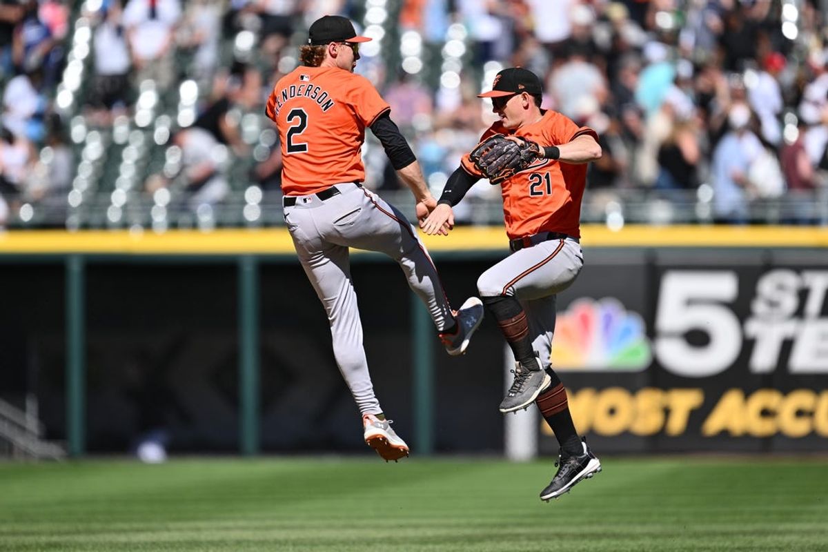 May 25, 2024; Chicago, Illinois, USA;  Baltimore Orioles infielder Gunnar Henderson (2) and outfielder Austin Hays (21) celebrate after defeating the Chicago White Sox at Guaranteed Rate Field. Mandatory Credit: Jamie Sabau-USA TODAY Sports