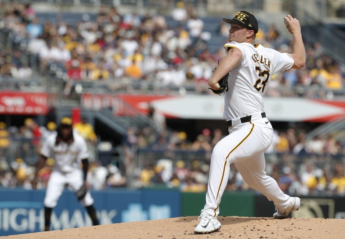May 25, 2024; Pittsburgh, Pennsylvania, USA;  Pittsburgh Pirates starting pitcher Mitch Keller (23) delivers a pitch against the Atlanta Braves during the first inning at PNC Park. Mandatory Credit: Charles LeClaire-USA TODAY Sports