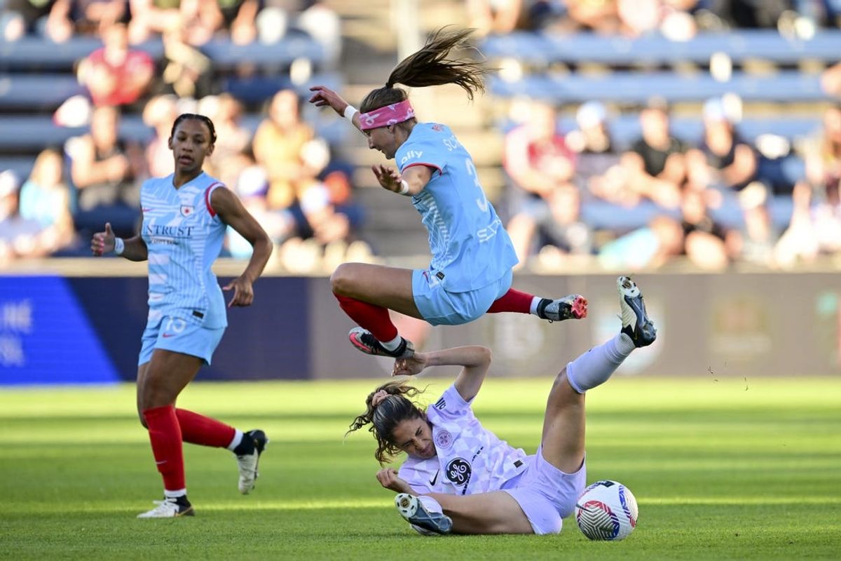 May 25, 2024; Bridgeview, Illinois, USA; Chicago Red Stars forward Ally Schlegal (34) and Racing Louisville FC midfielder Savannah DeMelo (7) collide during a play int he first half at SeatGeek Stadium. Mandatory Credit: Daniel Bartel-USA TODAY Sports