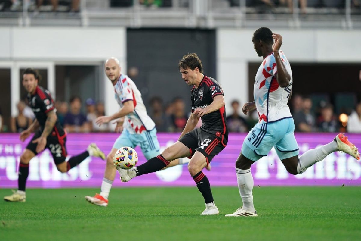 May 25, 2024; Washington, District of Columbia, USA; D.C. United midfielder Jared Stroud (8) plays the ball defended by Chicago Fire defender Carlos Terán (4)  at Audi Field. Mandatory Credit: Amber Searls-USA TODAY Sports