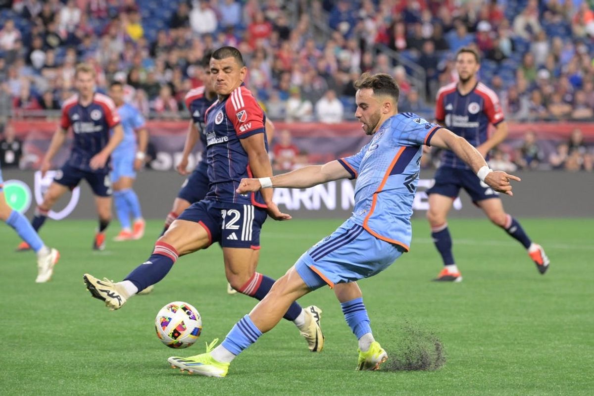 May 25, 2024; Foxborough, Massachusetts, USA; New York City FC forward Kevin O'Toole (22) shoots against New England Revolution defender Nick Lima (12) in the first half at Gillette Stadium. Mandatory Credit: Eric Canha-USA TODAY Sports