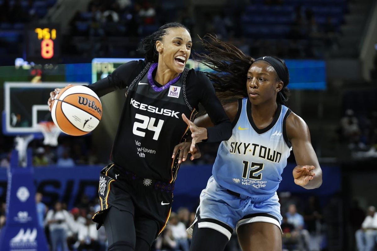 May 25, 2024; Chicago, Illinois, USA; Connecticut Sun forward DeWanna Bonner (24) drives to the basket against Chicago Sky forward Michaela Onyenwere (12) during the first half of a WNBA game at Wintrust Arena. Mandatory Credit: Kamil Krzaczynski-USA TODAY Sports