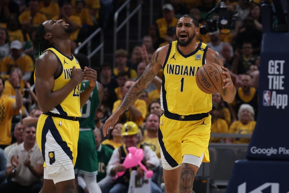 May 25, 2024; Indianapolis, Indiana, USA; Indiana Pacers forward Aaron Nesmith (23) and forward Obi Toppin (1) react during the first quarter of game three of the eastern conference finals against the Boston Celtics in the 2024 NBA playoffs at Gainbridge Fieldhouse. Mandatory Credit: Trevor Ruszkowski-USA TODAY Sports
