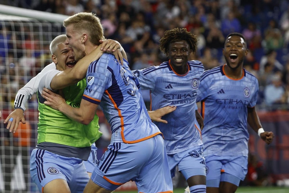 May 25, 2024; Foxborough, Massachusetts, USA; New York City midfielder Keaton Parks (55) is mobbed by teammates after scoring against the New England Revolution during the second half at Gillette Stadium. Mandatory Credit: Winslow Townson-USA TODAY Sports