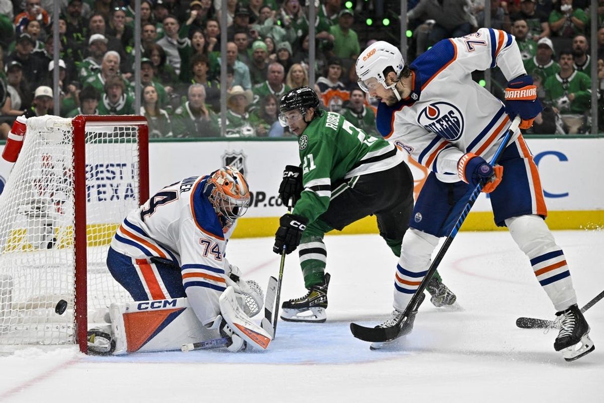 May 25, 2024; Dallas, Texas, USA; Edmonton Oilers goaltender Stuart Skinner (74) turns aside a shot by Dallas Stars left wing Jason Robertson (21) during the second period in game two of the Western Conference Final of the 2024 Stanley Cup Playoffs at American Airlines Center. Mandatory Credit: Jerome Miron-USA TODAY Sports
