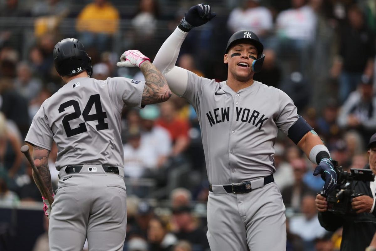 May 25, 2024; San Diego, California, USA; New York Yankees center fielder Aaron Judge (99) celebrates with left fielder Alex Verdugo (24) after hitting a two-run home run in the first inning at Petco Park. Mandatory Credit: Chadd Cady-USA TODAY Sports