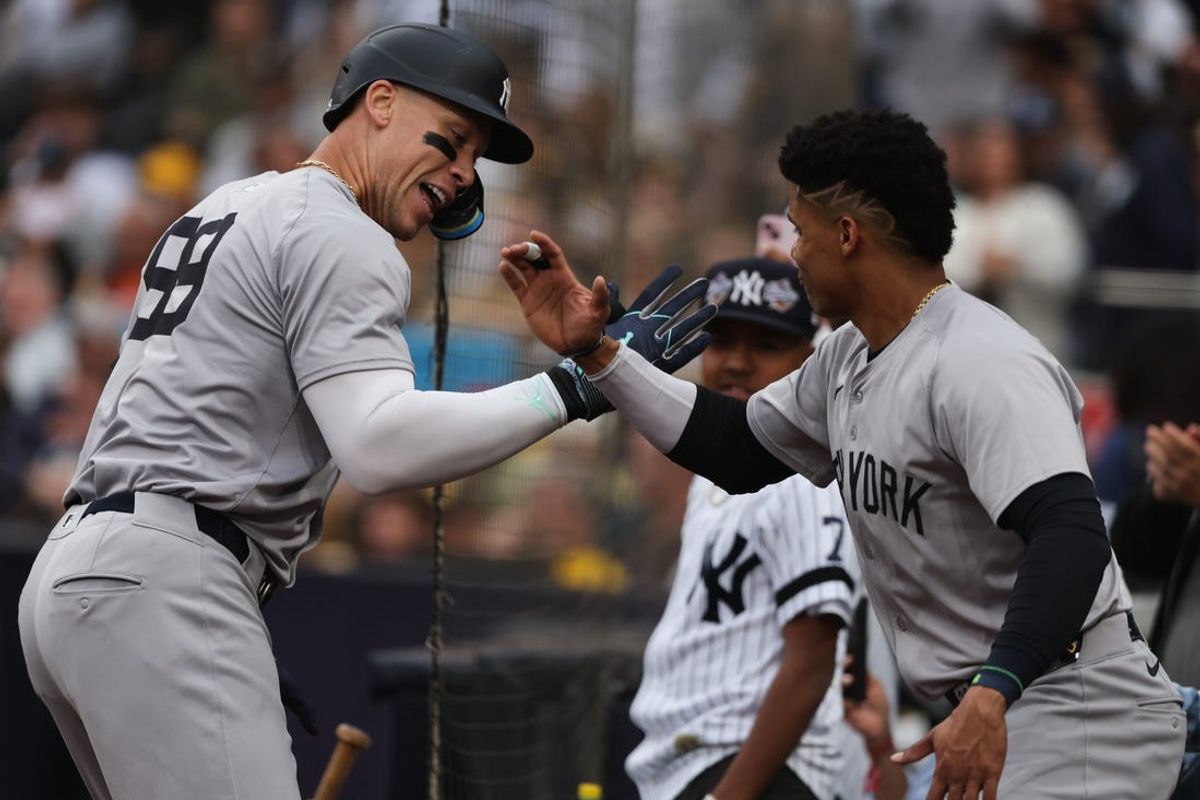 May 25, 2024; San Diego, California, USA; New York Yankees center fielder Aaron Judge (99) celebrates with right fielder Juan Soto (22) after hitting a two-run home run in the first inning at Petco Park. Mandatory Credit: Chadd Cady-USA TODAY Sports